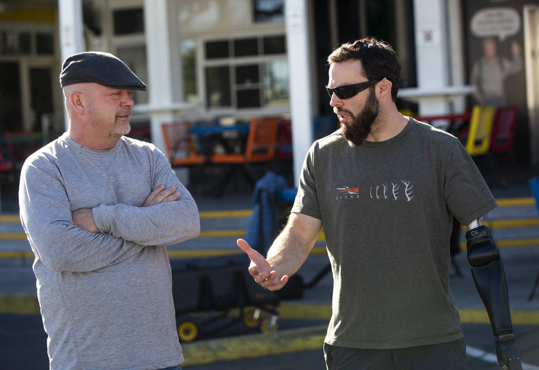 Rick Harrison, left, talks with Navy veteran and Purple Heart recipient Andrew Bottrell, who wa ...