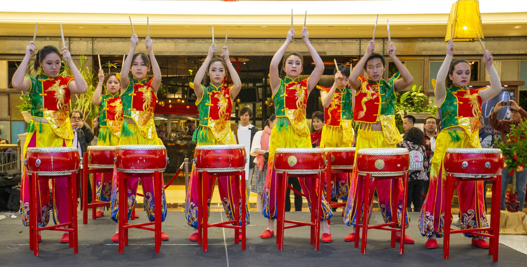 Members of the Li Ling Hong drum group perform at a reception as the Grand Canal Shoppes celebr ...