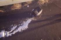 Methamphetamine that was in a suitcase is spread across Interstate 40 near Kingman, Arizona, on ...