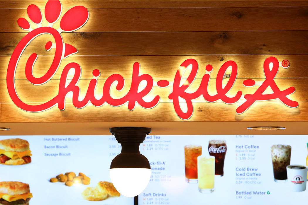 Chick-fil-A's sign and menu are displayed at the first Chick-fil-A restaurant inside the Golden ...
