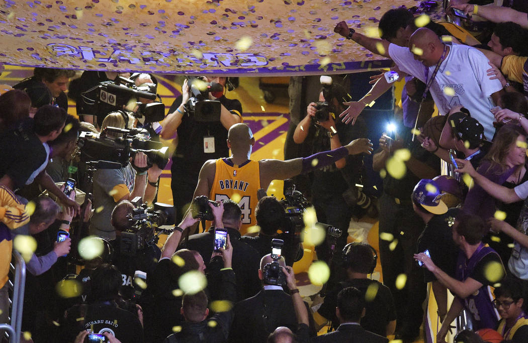 Los Angeles Lakers forward Kobe Bryant walks off the court after finishing his last NBA basketb ...
