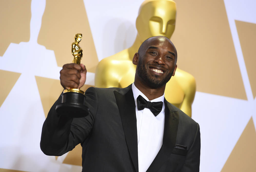 FILE - This March 4, 2018 file photo shows Kobe Bryant, winner of the award for best animated s ...