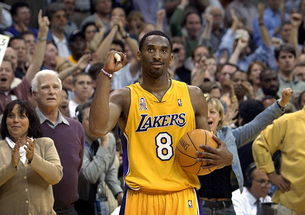 FILE - In this May 14, 2002 file photo Los Angeles Lakers guard Kobe Bryant watches the clock r ...