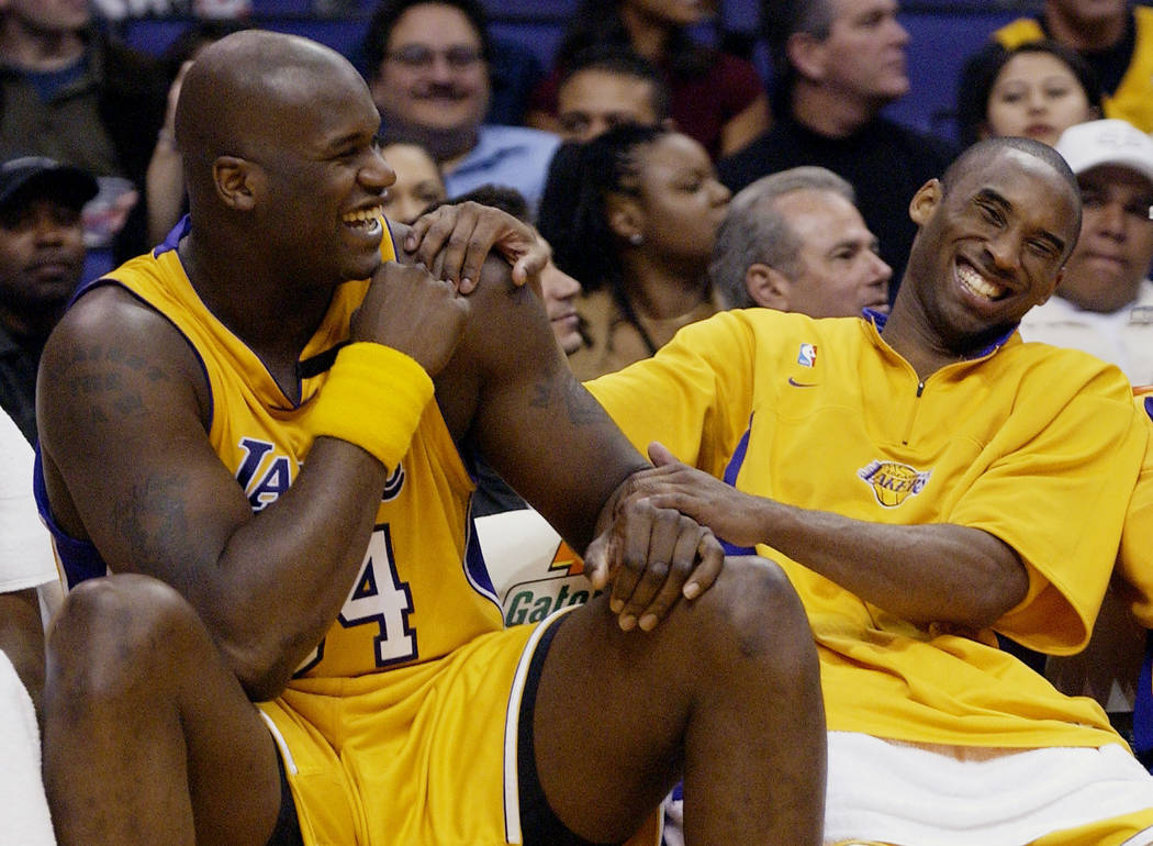 FILE - In this April 15, 2003, file photo, Los Angeles Lakers Shaquille O'Neal, left, and Kobe ...