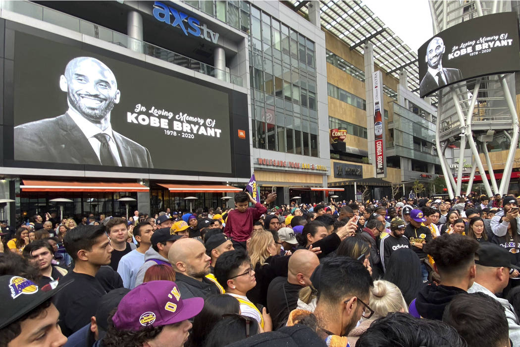 Thousands of fans mourn the loss of Kobe Bryant with makeshift memorials in front of La Live ac ...