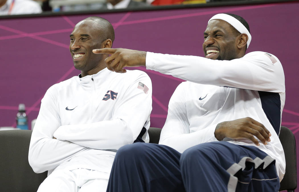 USA's Lebron James, right, and Kobe Bryant react during the second half of a preliminary men's ...