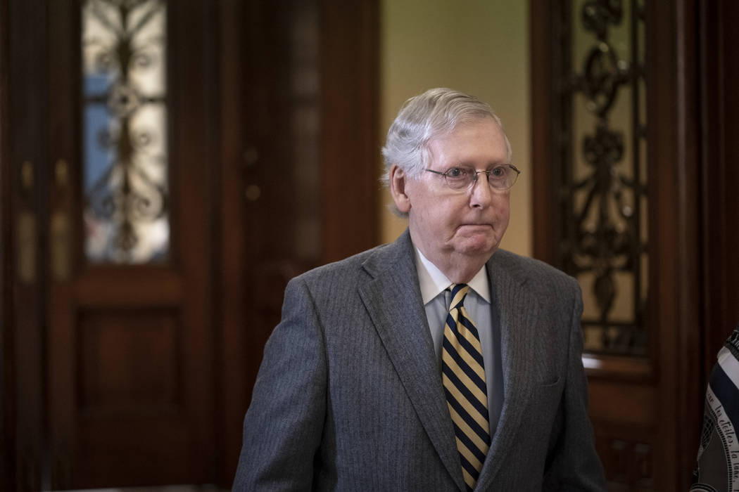 Senate Majority Leader Mitch McConnell, R-Ky., leaves the chamber during a break in the impeach ...