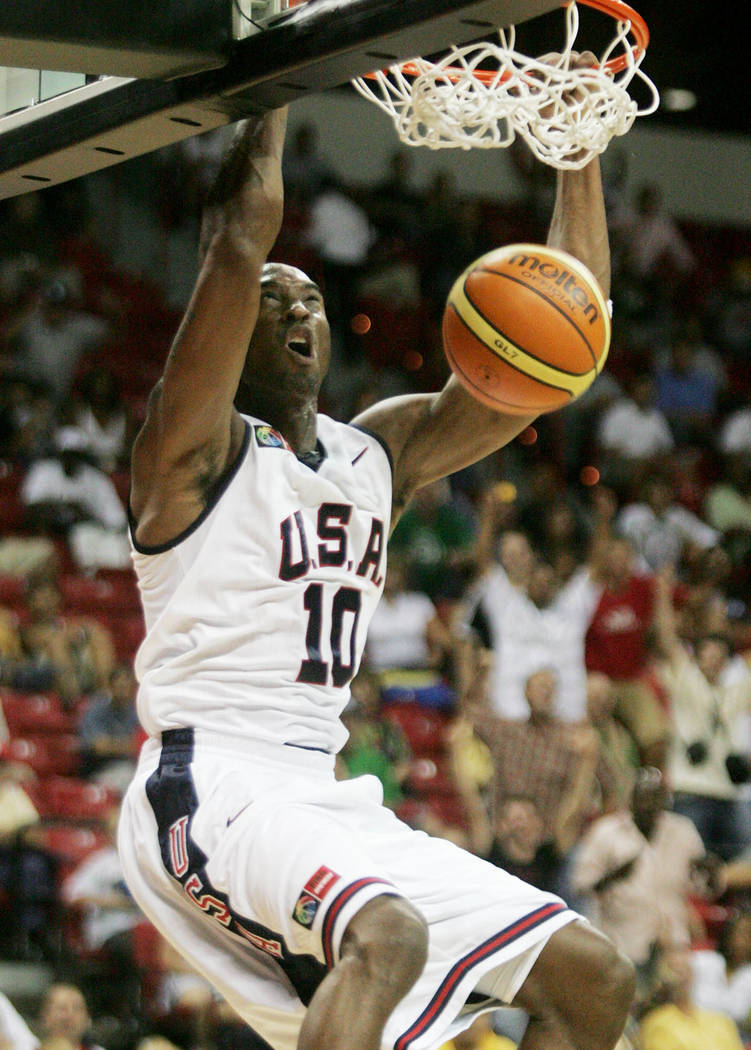 Team USA basketball player Kobe Bryant (10) slams for two points during the second period of th ...