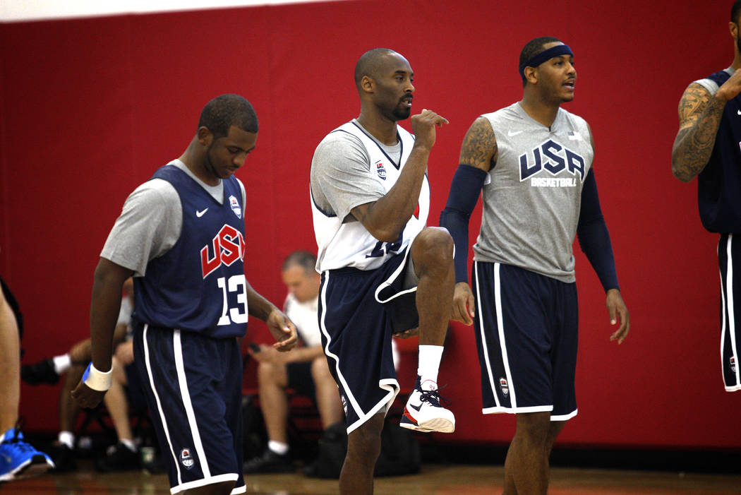 2012 USA Basketball Men's National Team player Kobe Bryant, center, stretches with teammates at ...