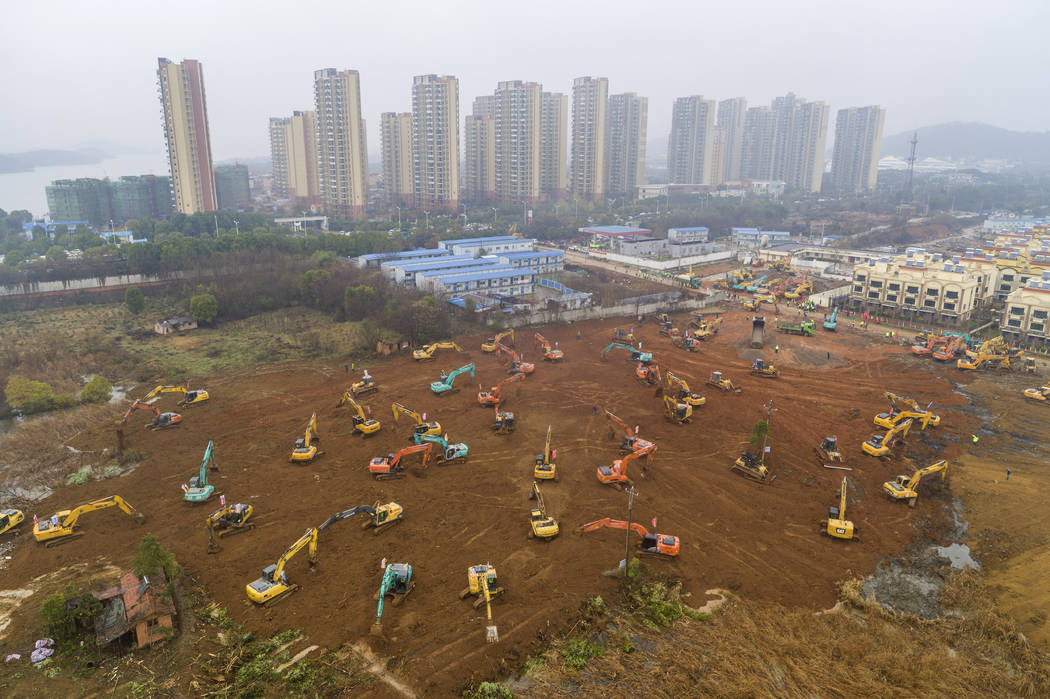 FILE - In this Friday, Jan. 24, 2020, file photo, heavy equipment works at a construction site ...