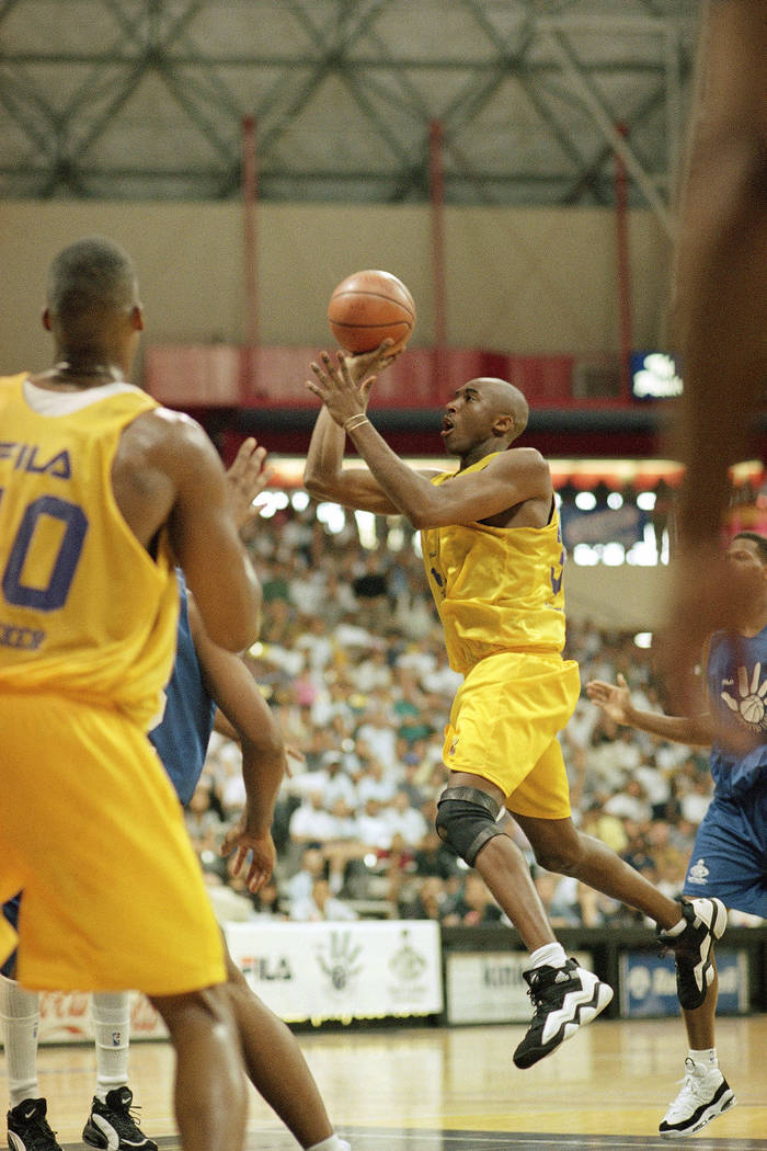 Newly-acquired Los Angeles Laker Kobe Bryant drives the open lane during a summer league game a ...