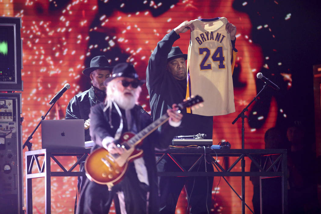 Joseph Simmons holds a jersey of the late Kobe Bryant at the 62nd annual Grammy Awards on Sunda ...