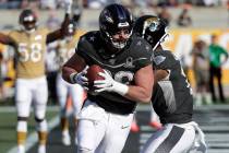AFC tight end Mark Andrews, of the Baltimore Ravens, (89) scores a touchdown, during the first ...