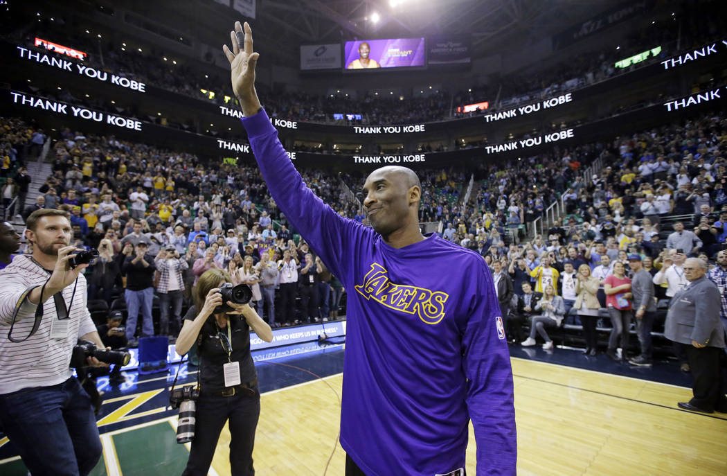 FILE - In this March 28, 2016, file photo, Los Angeles Lakers forward Kobe Bryant waves to the ...