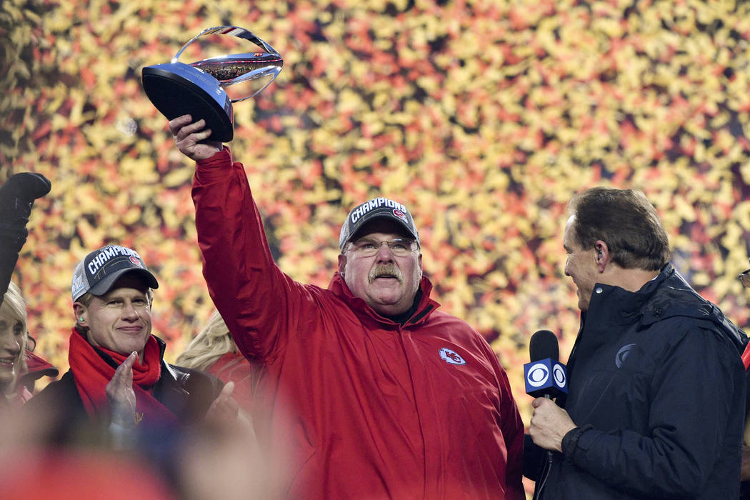 Kansas City Chiefs head coach Andy Reid holds the Lamar Hunt Trophy after the NFL AFC Champions ...