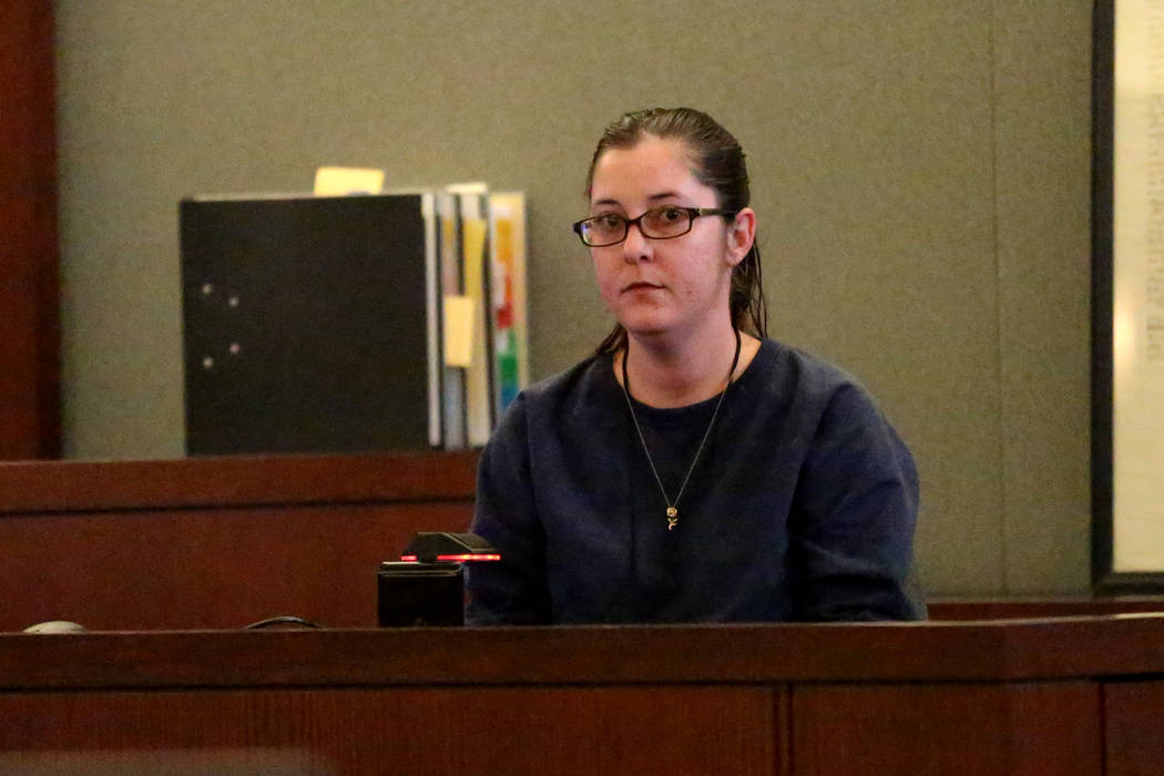 Lee's Liquor assistant store manager Jamie Henderson listens to her 911 call during her testimo ...