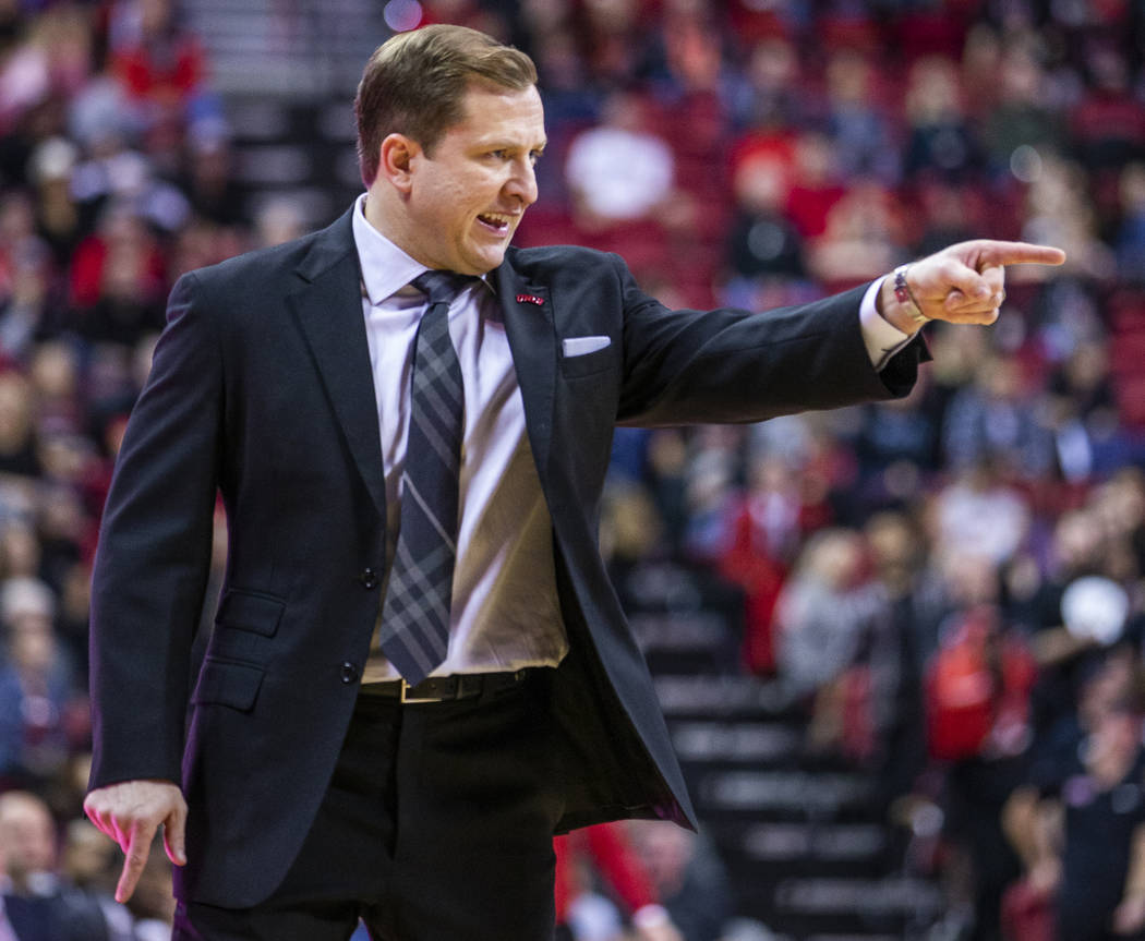 UNLV Rebels head coach T.J.Otzelberger directs his players on the court versus the New Mexico L ...