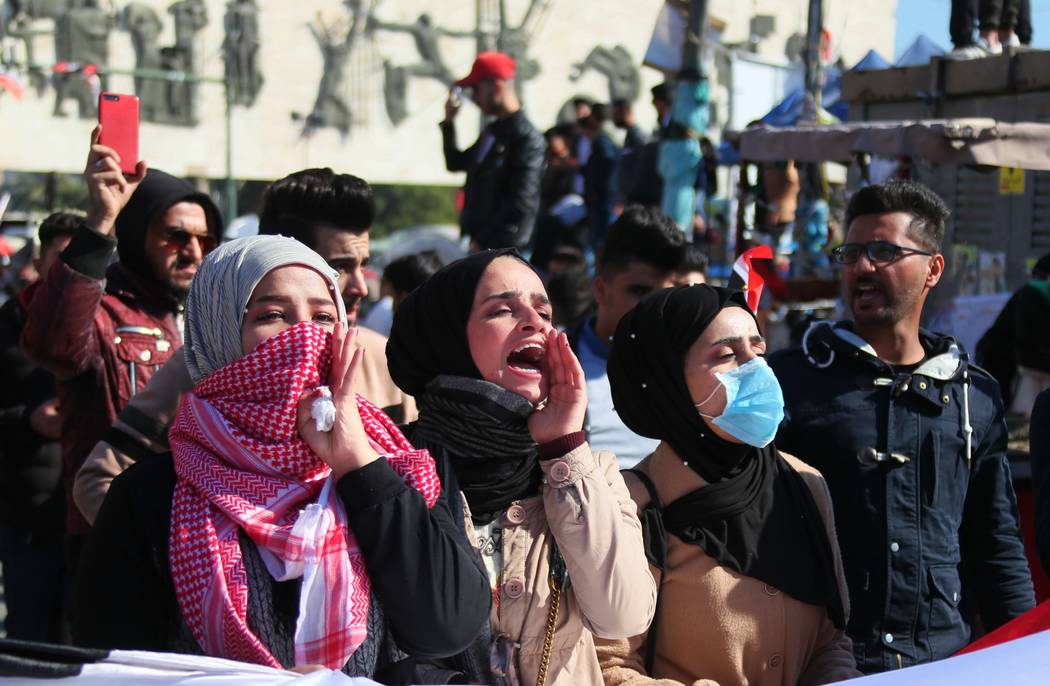 Anti-government protesters gather in Tahrir Square in Baghdad, Iraq, Sunday, Jan. 26, 2020. (AP ...