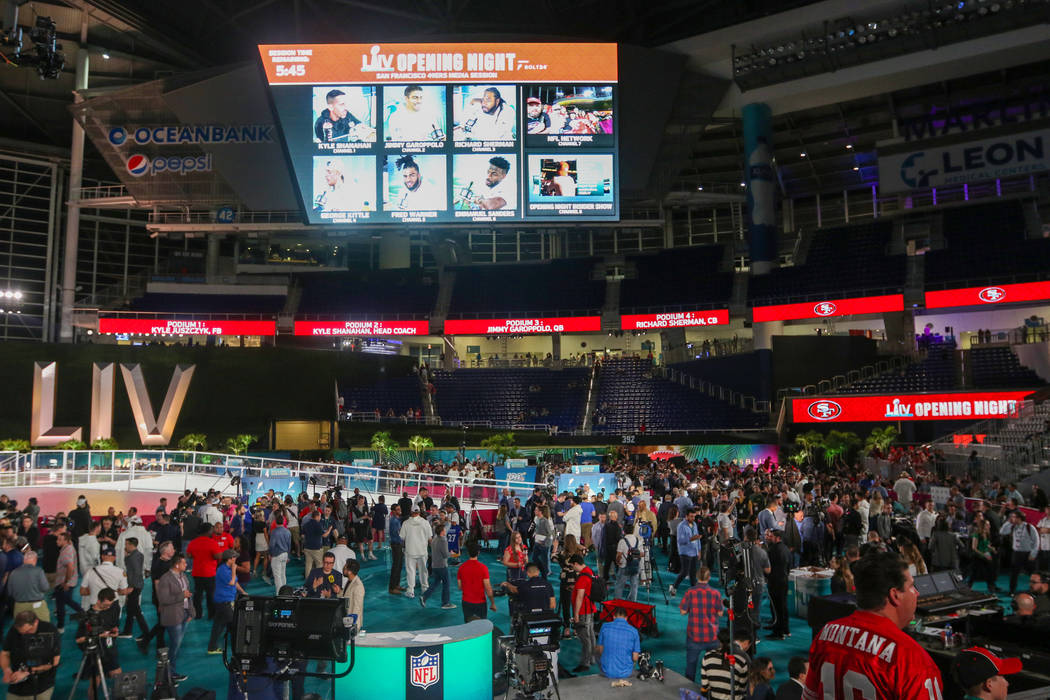 Fans and media attend Super Bowl LIV Opening Night in Marlins Park in Miami, Fla., Monday, Jan. ...