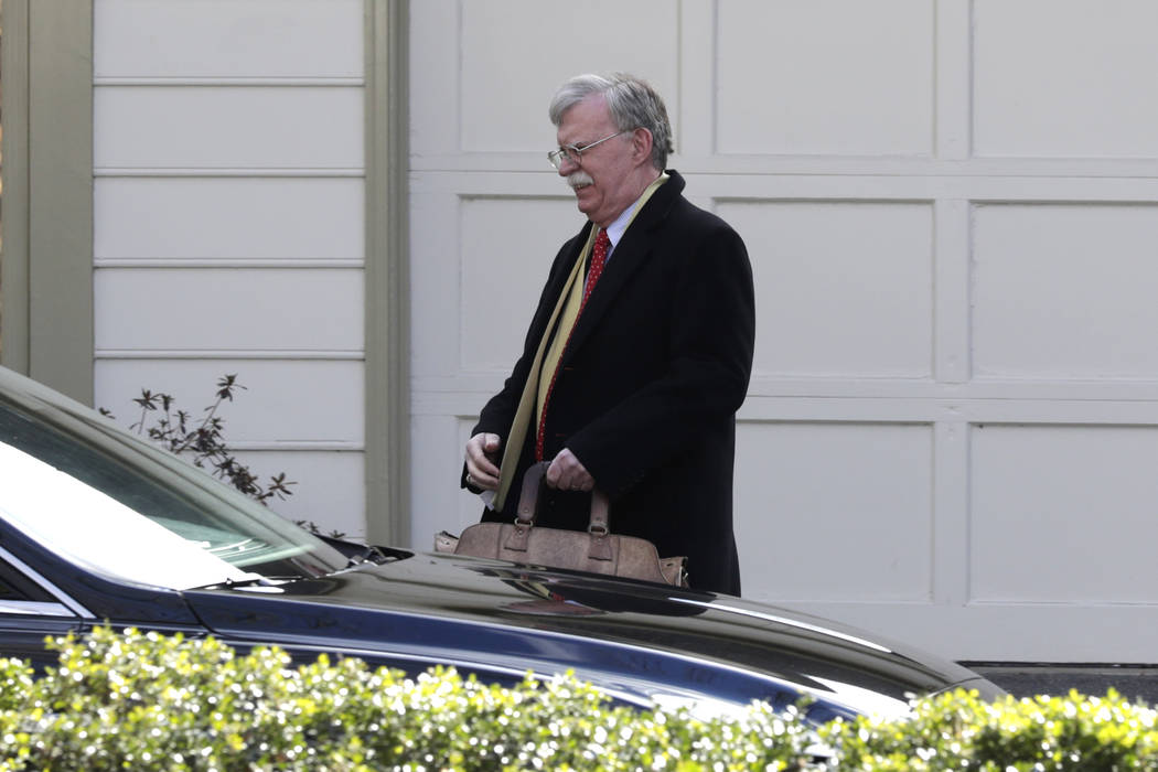 Former National security adviser John Bolton leaves his home in Bethesda, Md., Tuesday, Jan. 28 ...