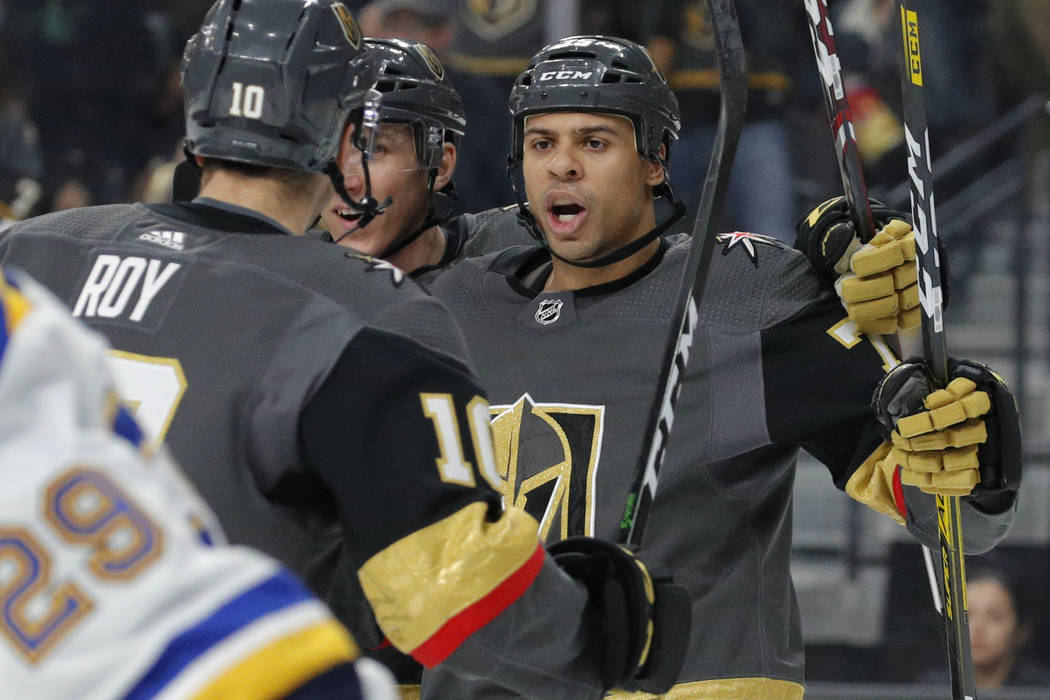 Minnesota Wild hockey player Ryan Reaves, right, pretends to fight with  Hayden Spalin during a youth hockey clinic with NHL top draft prospects and  members of the NHL Player Inclusion Coalition, Tuesday