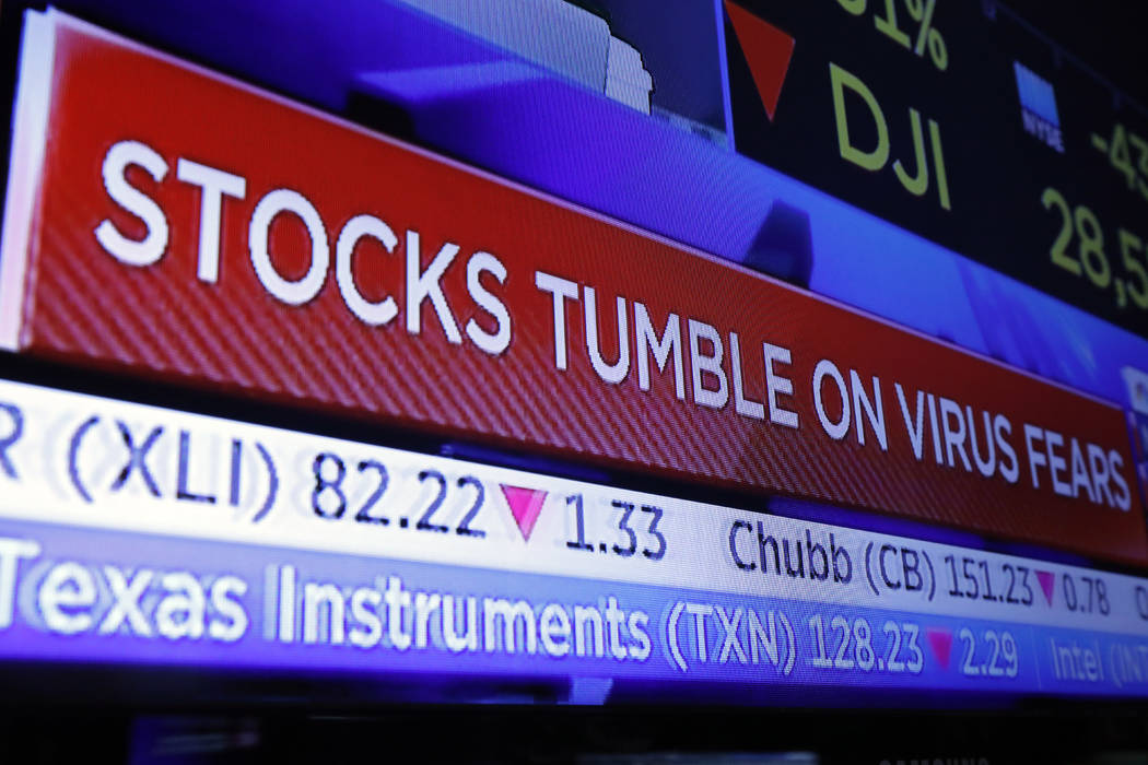 A television screen headlines trading on the floor of the New York Stock Exchange, Monday, Jan. ...