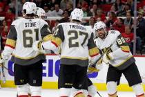 Vegas Golden Knights right wing Alex Tuch (89) celebrates with defenseman Shea Theodore (27) an ...
