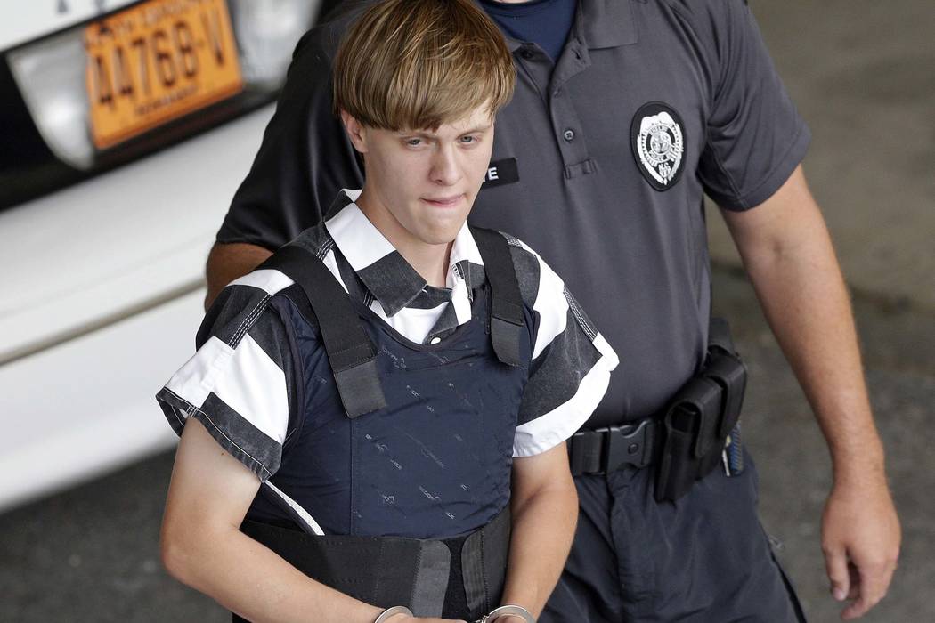 Dylann Roof is escorted from the Cleveland County Courthouse in Shelby, N.C., June 18, 2015. (C ...
