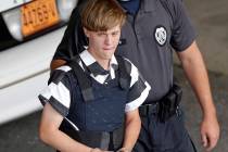 Dylann Roof is escorted from the Cleveland County Courthouse in Shelby, N.C., June 18, 2015. (C ...