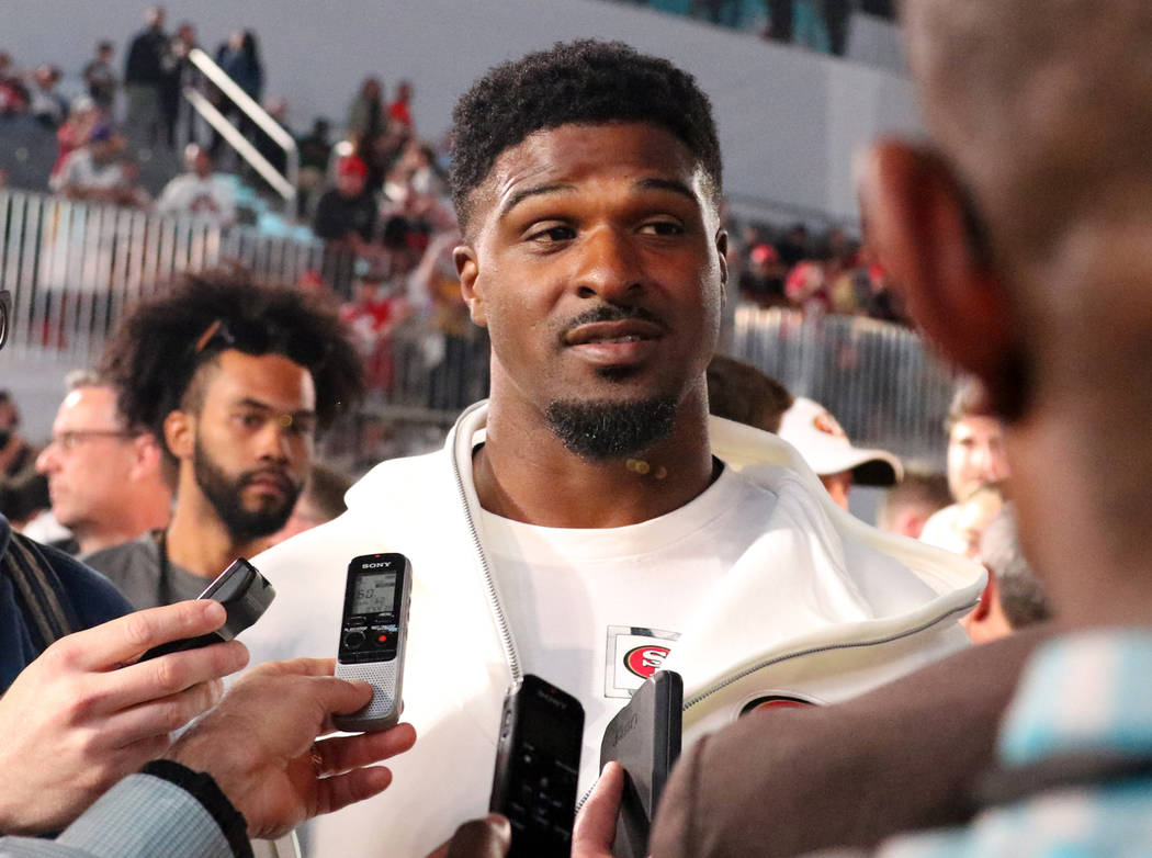 San Francisco 49ers defensive end Dee Ford takes questions from media during Super Bowl LIV Ope ...