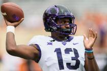 TCU quarterback Justin Rogers (13) warms up before a game against Longhorns. Saturday, Septembe ...