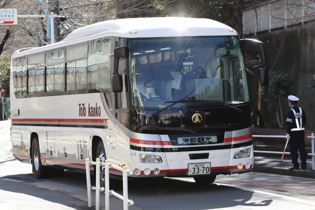 A bus carrying some Japanese evacuees from Wuhan, China, arrives at National Center for Global ...