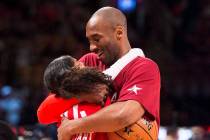 In a Feb. 14, 2016, file photo, Los Angeles Lakers Kobe Bryant (24) hugs his daughter Gianna on ...