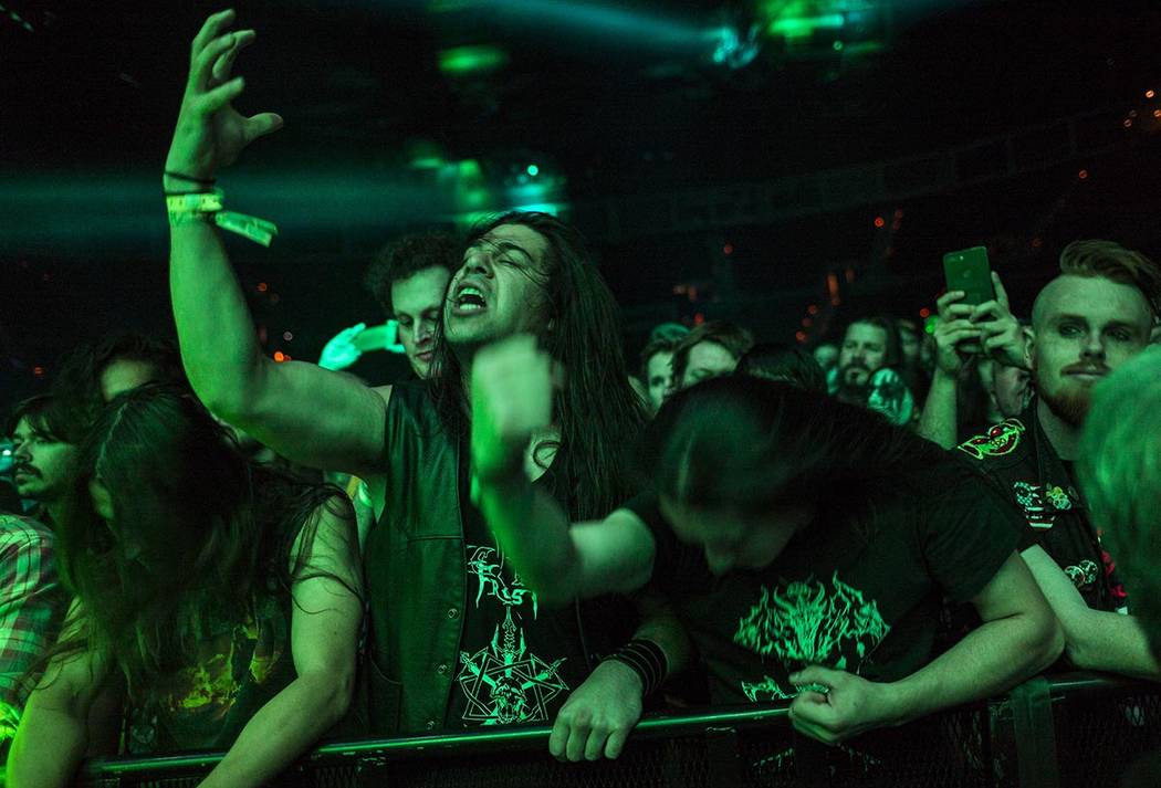 Fans react as Triumph of Death performs at the Mandalay Bay Events Center during the Psycho Las ...