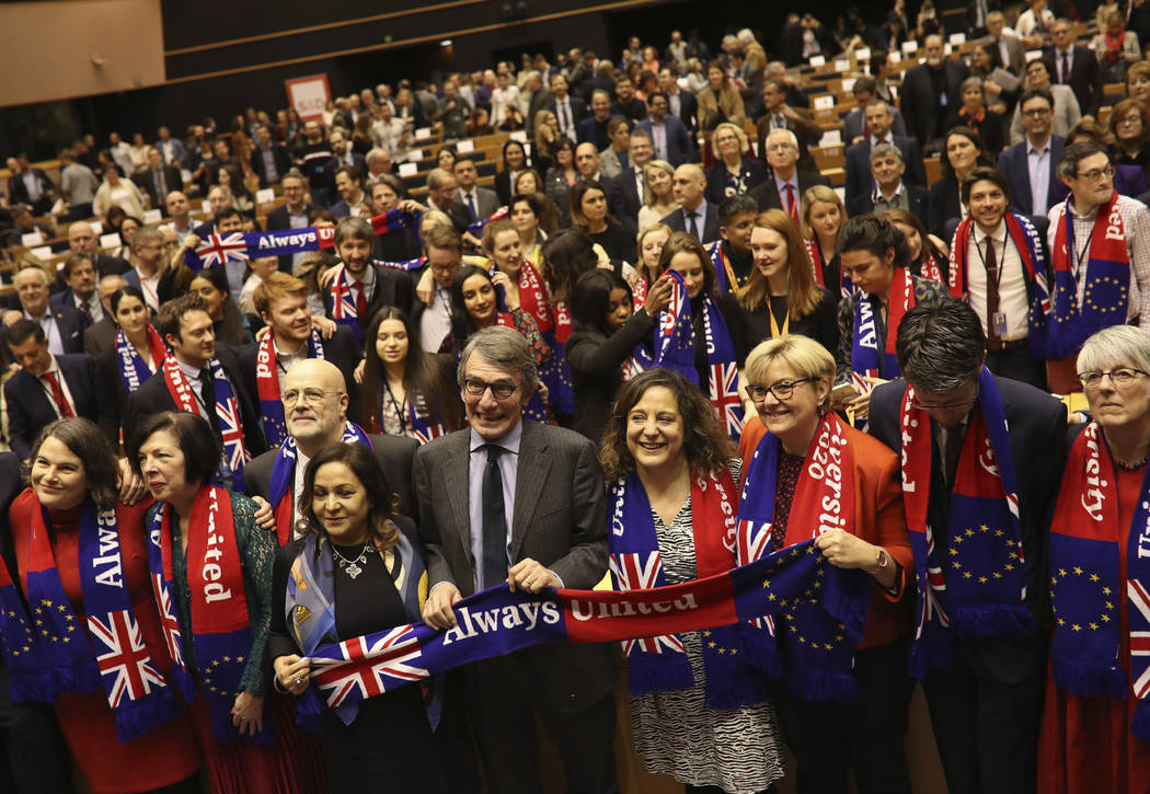 European Parliament President David Sassoli, center, stands with other British MEP's and member ...