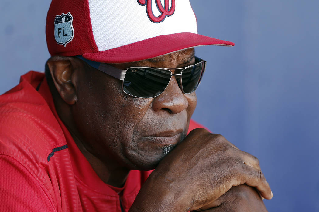 FILE - In this March 11, 2017, file photo, Washington Nationals manager Dusty Baker talks to re ...