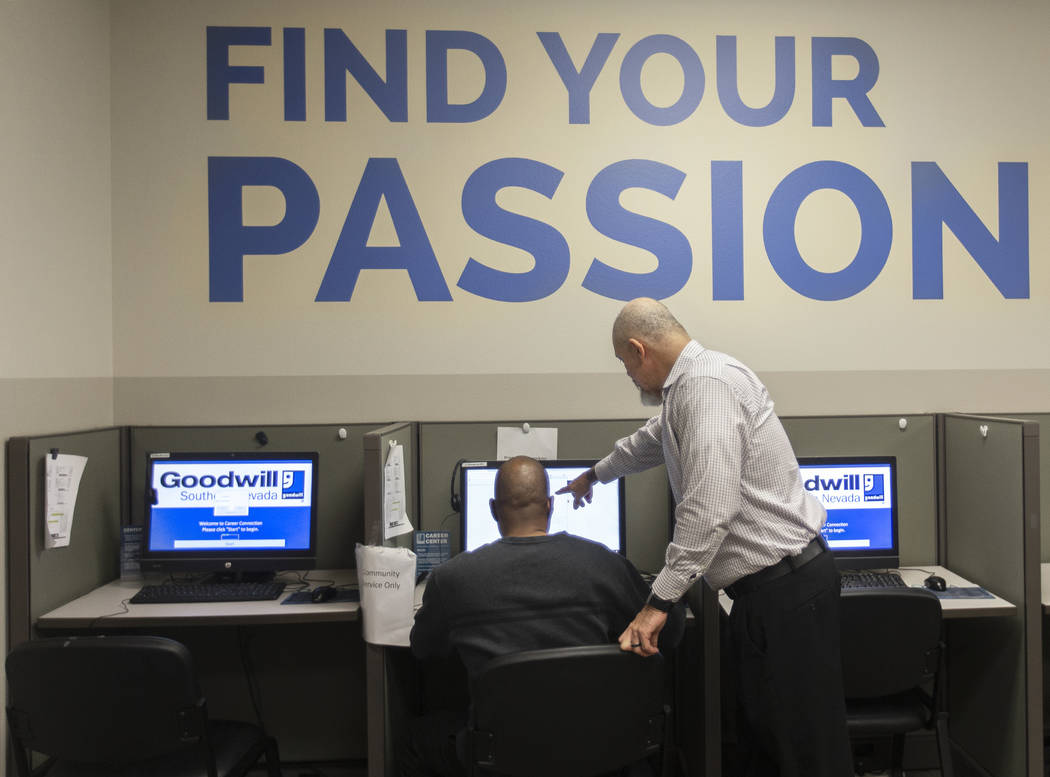 Marco Martinez, right, assists Donald Chapman at the Goodwill of Southern Nevada's career cente ...