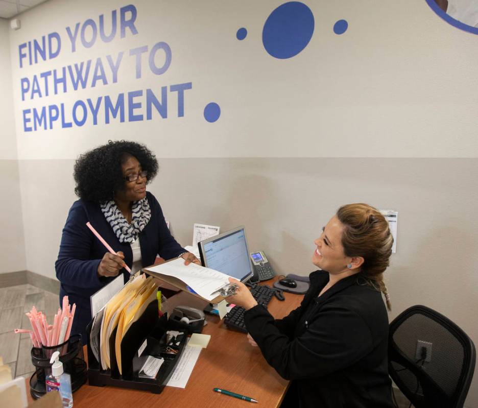 Martha Guizar, right, assists Wanda Freedie at the Goodwill of Southern Nevada's career center ...