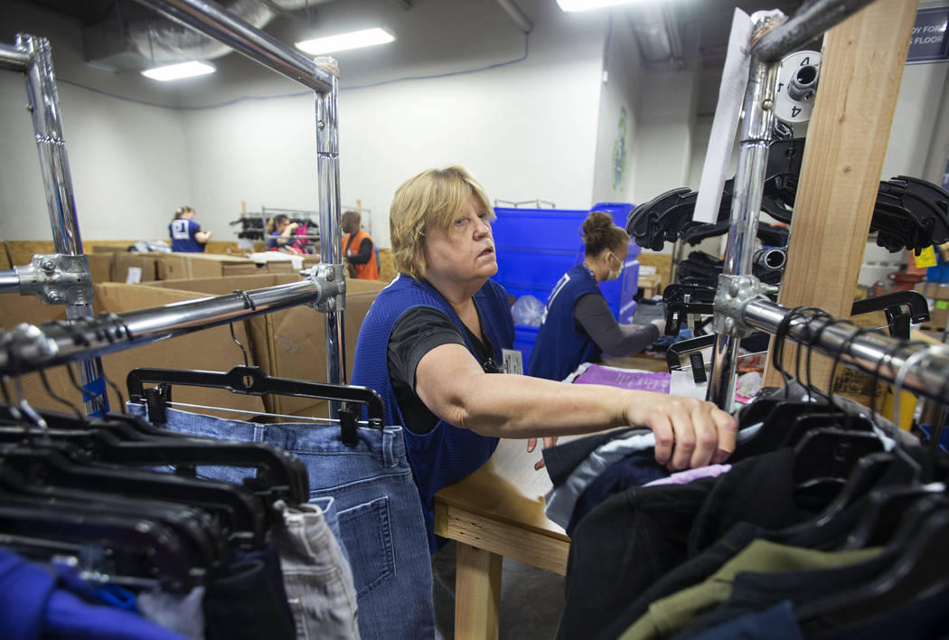 Linda Muth, left, sorts donated clothing at Goodwill of Southern Nevada on Wednesday, Jan. 29, ...