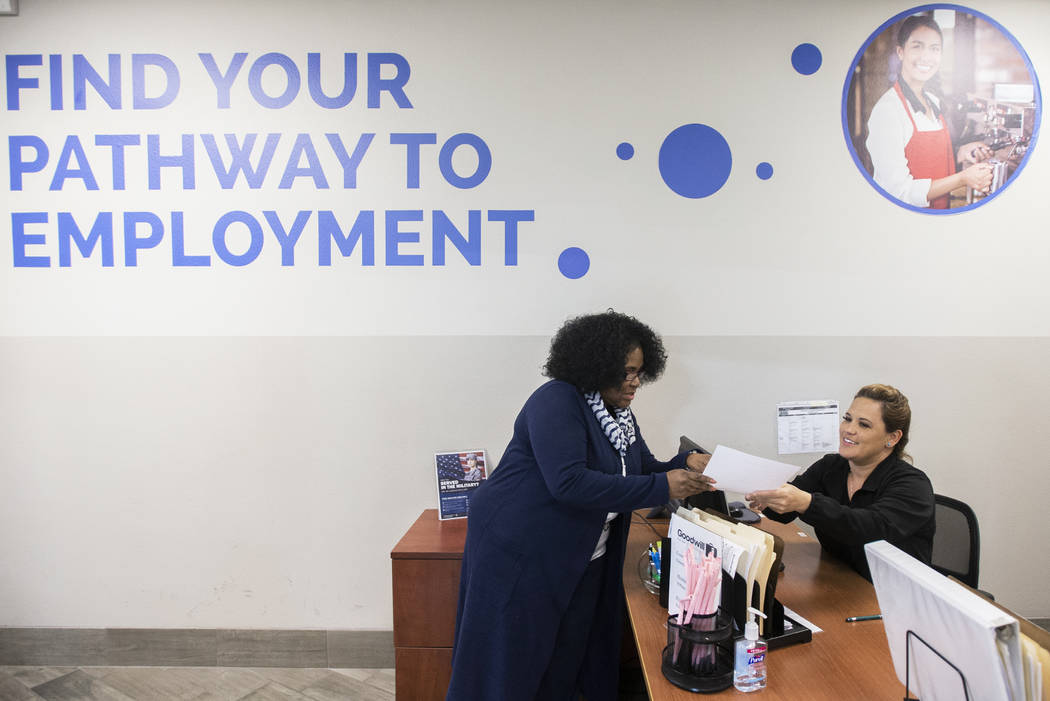 Martha Guizar, right, assists Wanda Freedie at the Goodwill of Southern Nevada's career center ...