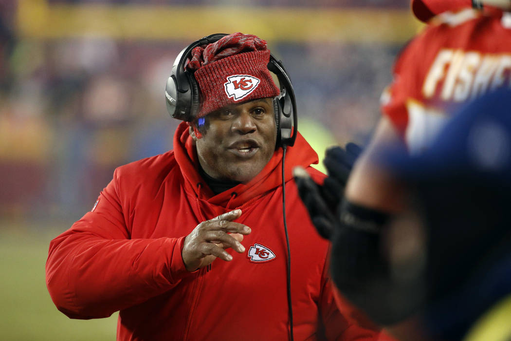 In this Jan. 20, 2019, file photo, Kansas City Chiefs offensive coordinator Eric Bieniemy gestu ...