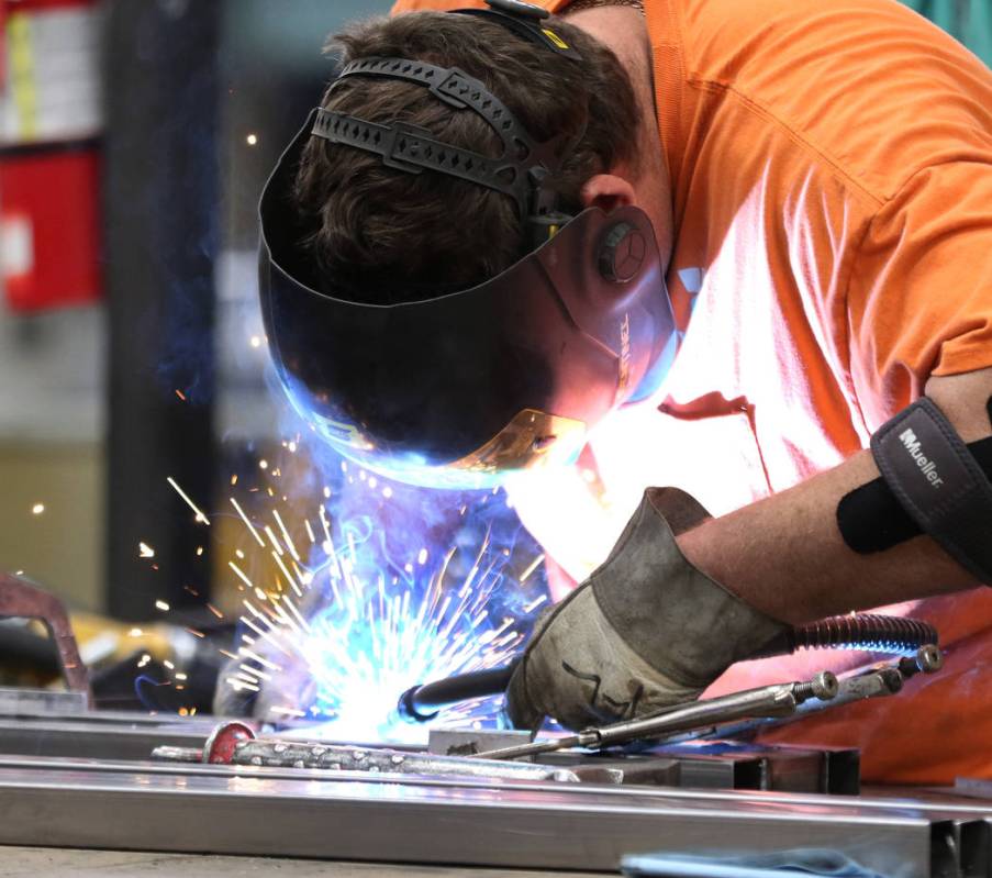 Vernon Winch welds metal frame for the new Allegiant Stadium signage that's being built by Yesc ...