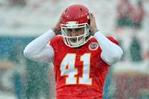 Kansas City Chiefs long snapper James Winchester (41) adjusts his helmet before an NFL division ...