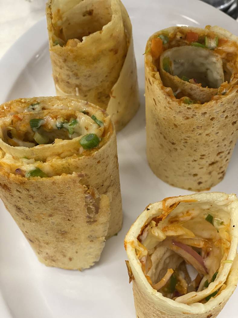 Jini-dosa are stuffed with vegetables and Schezwan and tomato sauces. (Divine Dosa & Biryani)