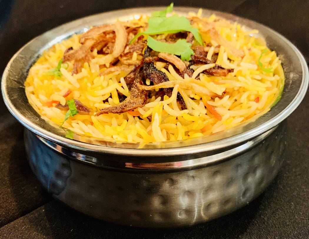 Dum-Biryani, in which the lid is sealed to the pot to increase pressure. (Divine Dosa & Biryani)