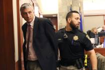 Former attorney William Gamage led out of the courtroom after his sentencing at the Regional Ju ...