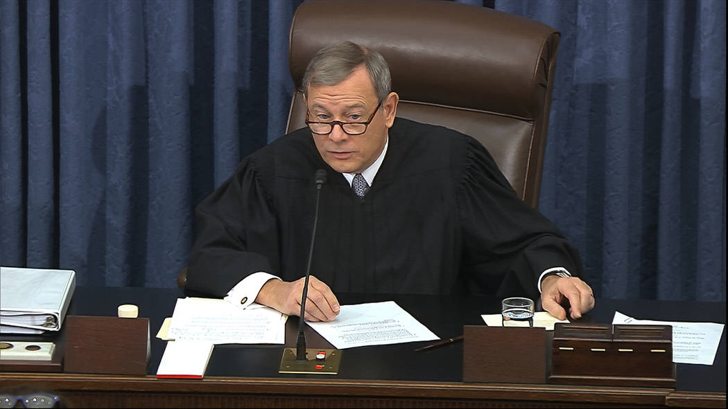 In this image from video, presiding officer Chief Justice of the United States John Roberts get ...