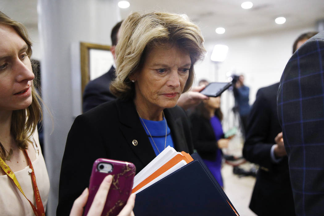 Sen. Lisa Murkowski, R-Alaska, speaks with reporters during the impeachment trial of President ...