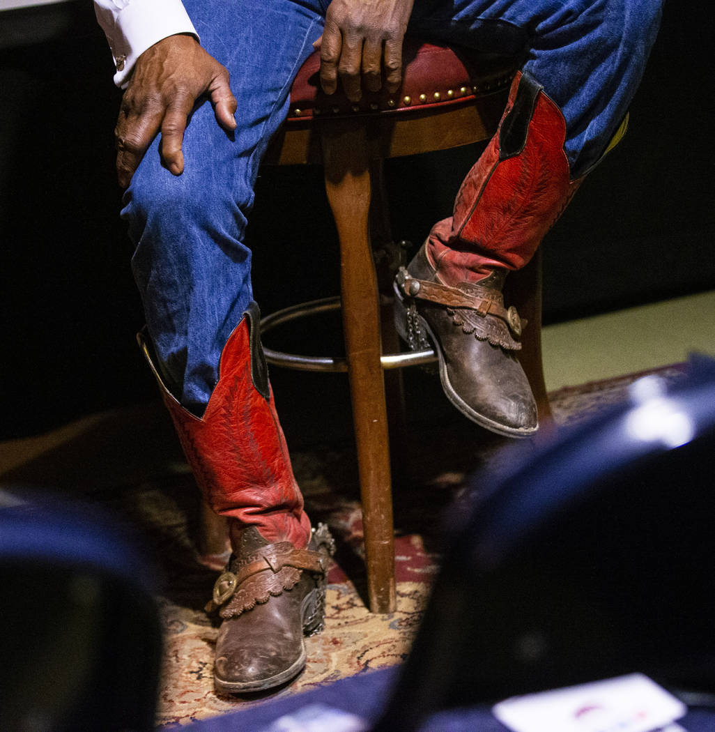 The boots of Pete Taylor, of Oakland, Calif., are seen as he talks about his experiences as a c ...