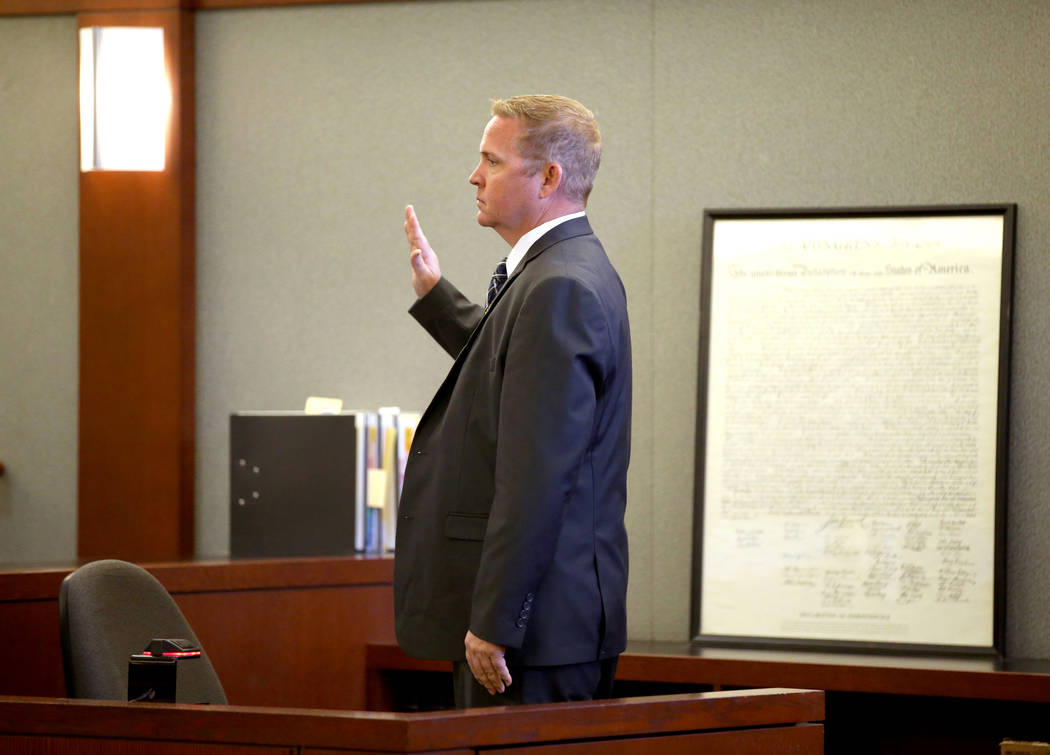 Las Vegas police homicide detective Jason McCarthy is sworn in as a witness during the trial of ...